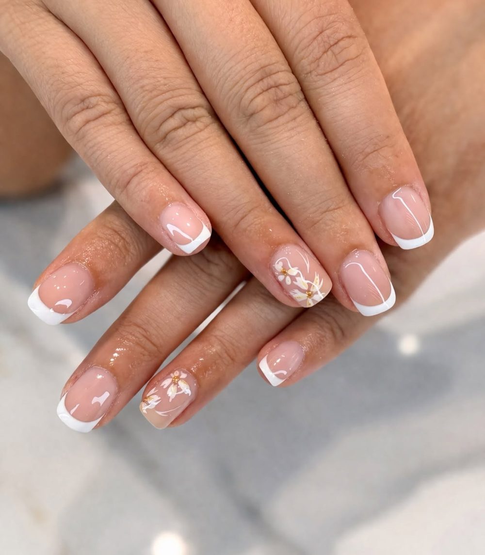 Milky French tip nails with delicate art